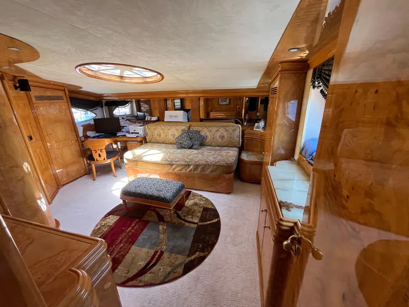 Slide: The Image of Luxurious interior of 2001 Astondoa 95GLX yacht with elegant wood finishes and plush seating. - 49