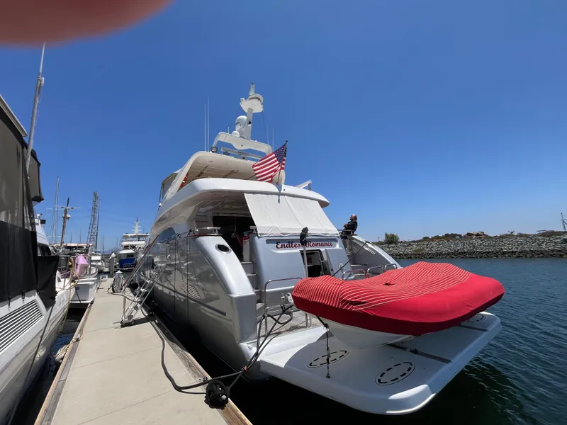 Slide: The Image of Astondoa 95GLX yacht from 2001 docked at marina under clear blue sky. - 5