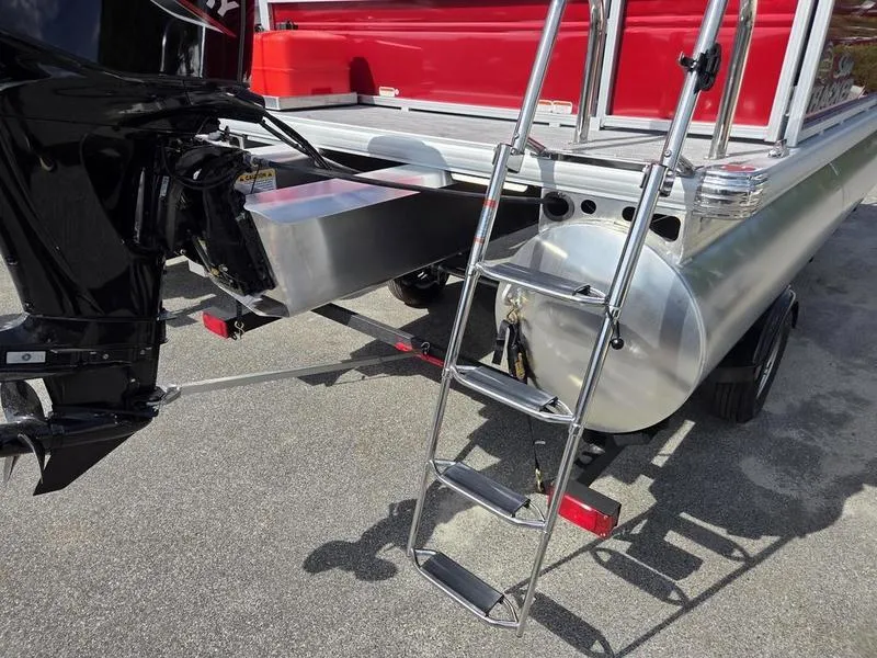Slide: The Image of 2026 Sun Tracker PB 16 DLX pontoon boat with ladder and motor, rear view. - 10