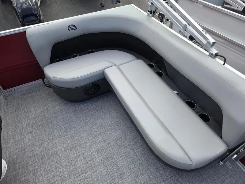 Slide: The Image of 2026 Sun Tracker PB 16 DLX boat interior with gray seating and cup holders. - 3