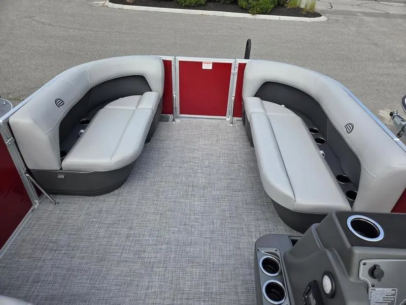 Slide: The Image of 2026 Sun Tracker PB 16 DLX pontoon boat interior with gray seating and red accents. - 6