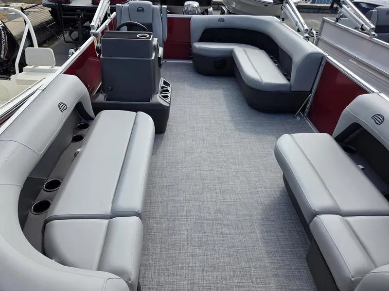 Slide: The Image of 2026 Sun Tracker PB 16 DLX pontoon boat interior with gray seating and red accents. - 8