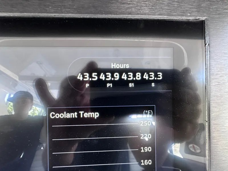 Slide: The Image of 2024 Cigarette 42 Auroris boat interior with blue upholstery and integrated speakers. - 13