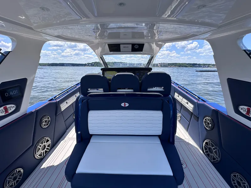 Slide: The Image of 2024 Cigarette 42 Auroris with four powerful outboard engines on a scenic lake. - 15