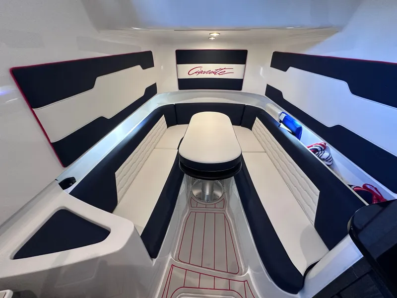 Slide: The Image of 2024 Cigarette 42 Auroris boat on a sunny lake with waterfront homes. - 16