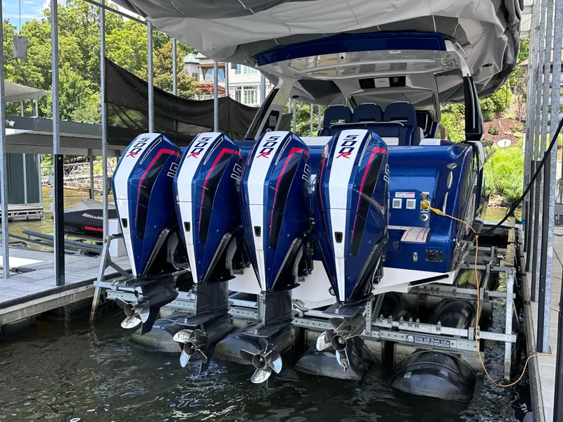 Slide: The Image of 2024 Cigarette 42 Auroris boat dashboard with Garmin navigation system and steering wheel. - 20