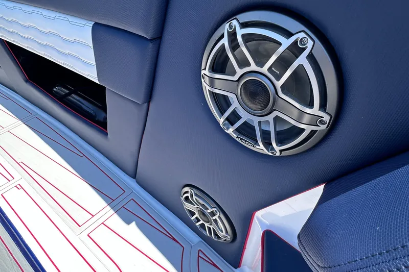 Slide: The Image of 2024 Cigarette 42 Auroris boat on a sunny lake, featuring sleek blue and white design. - 30