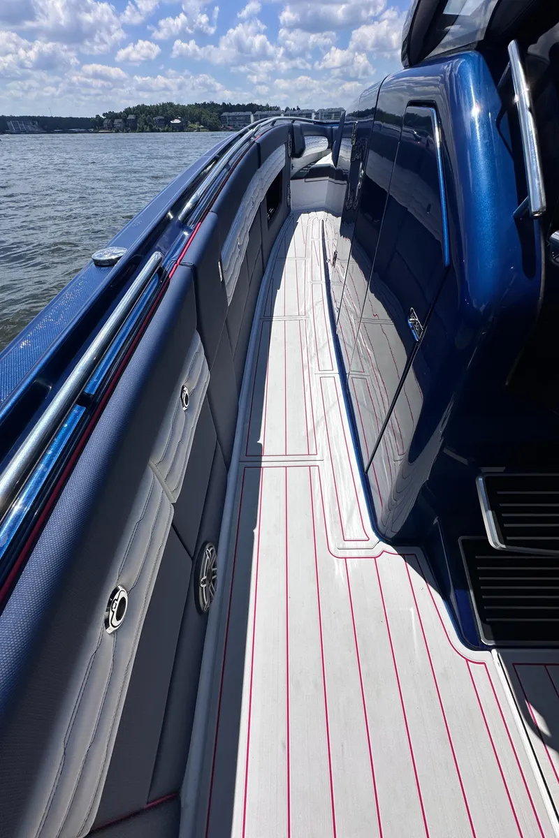 Slide: The Image of 2024 Cigarette 42 Auroris boat interior with JL Audio speakers and stylish upholstery. - 32