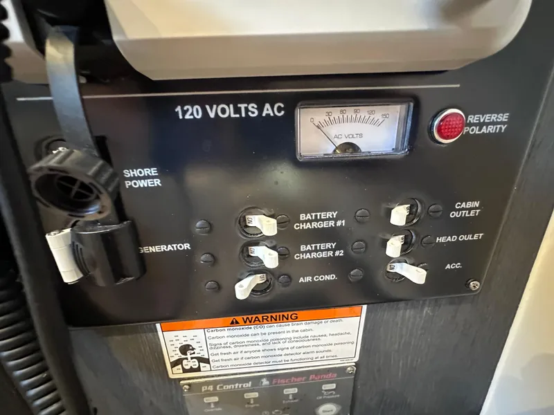 Slide: The Image of Control panel of 2024 Cigarette 42 Auroris with voltage meter and switches. - 39