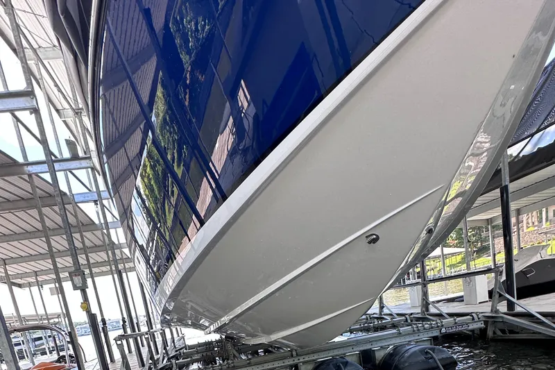 Slide: The Image of 2024 Cigarette 42 Auroris boat on a lift, showcasing sleek hull design. - 41
