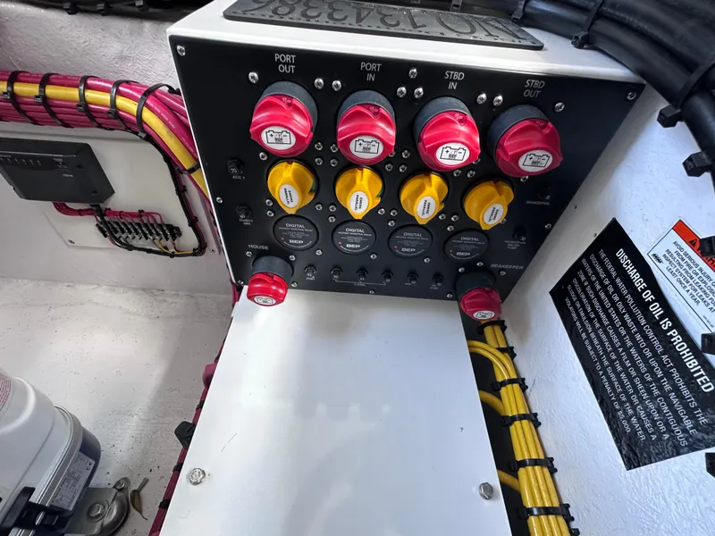 Slide: The Image of Control panel of 2024 Cigarette 42 Auroris boat with labeled switches and wiring. - 43