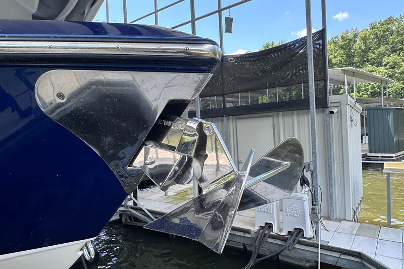 Slide: The Image of 2024 Cigarette 42 Auroris boat with a shiny metal anchor at a dock. - 47