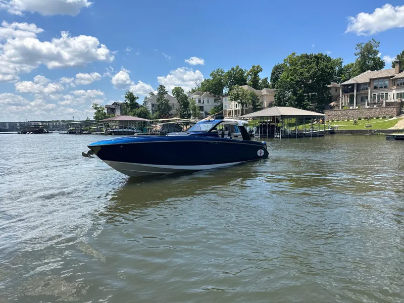 Slide: The Image of 2024 Cigarette 42 Auroris dashboard with advanced navigation screens and steering wheel. - 5