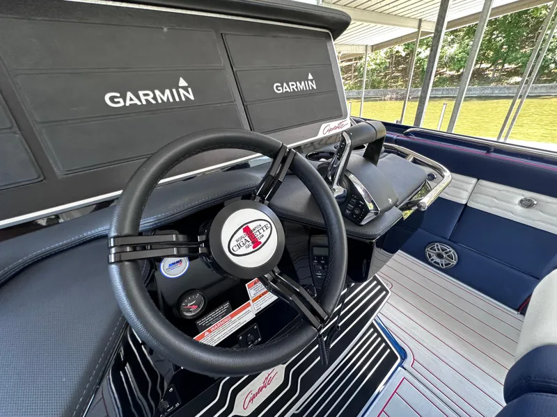 Slide: The Image of 2024 Cigarette 42 Auroris boat interior with GPS speed display on water. - 8
