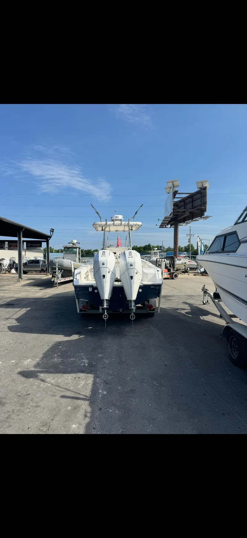 Slide: The Image of 2007 SeaCraft 25 boat with dual engines in a marina setting. - 3