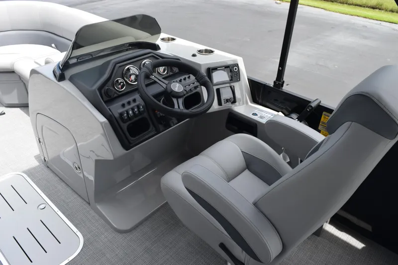 Slide: The Image of 2026 Bentley Pontoons Legacy 223 Navigator interior with modern helm and seating. - 11