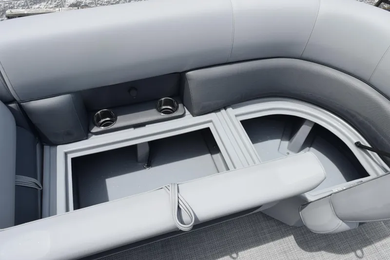 Slide: The Image of 2026 Bentley Pontoons Legacy 223 Navigator interior seating with storage and cup holders. - 15
