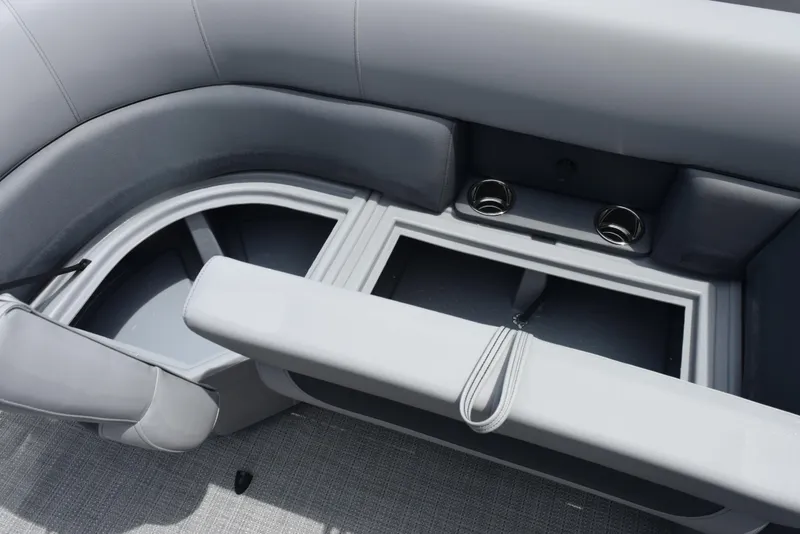 Slide: The Image of 2026 Bentley Pontoons Legacy 223 Navigator interior seating with storage compartments. - 16