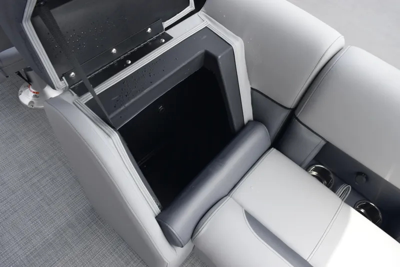 Slide: The Image of 2026 Bentley Pontoons Legacy 223 Navigator interior storage compartment with cup holders. - 18