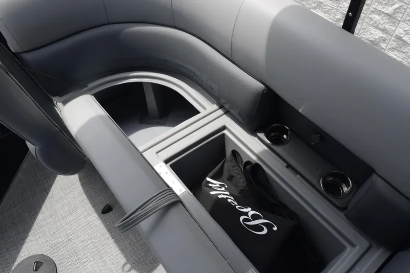 Slide: The Image of 2026 Bentley Pontoons Legacy 223 Navigator interior storage with cup holders and branded bag. - 20