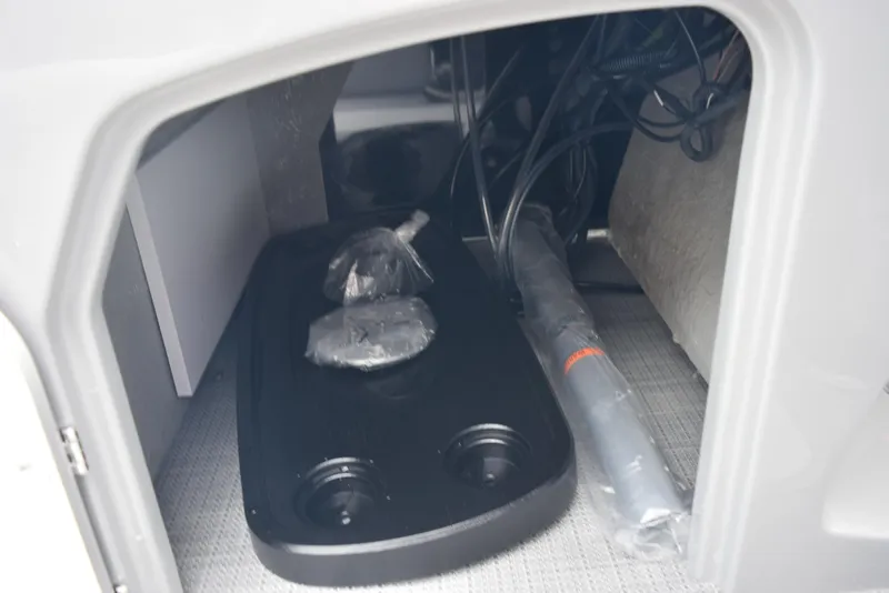 Slide: The Image of Storage compartment of 2026 Bentley Pontoons Legacy 223 Navigator with accessories and wiring. - 22