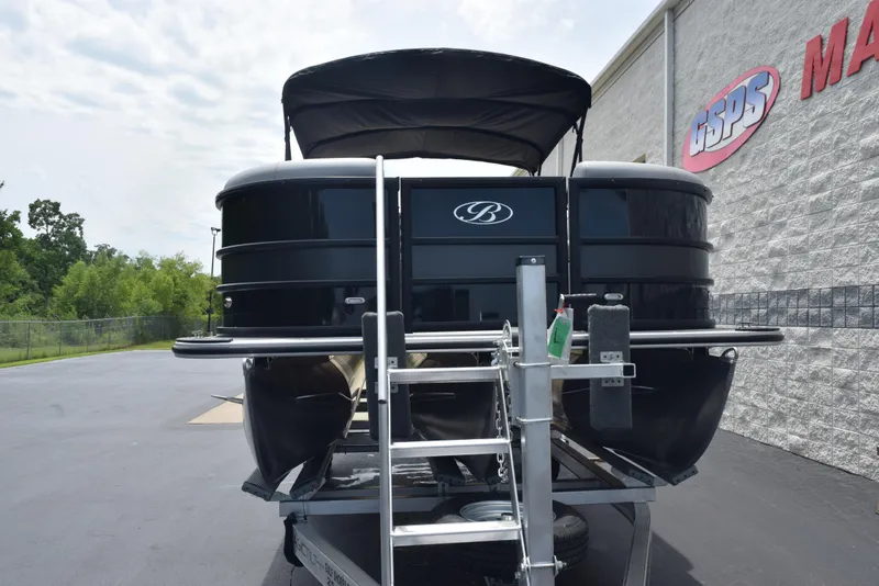 Slide: The Image of 2026 Bentley Pontoons Legacy 223 Navigator on trailer, parked outside dealership. - 3