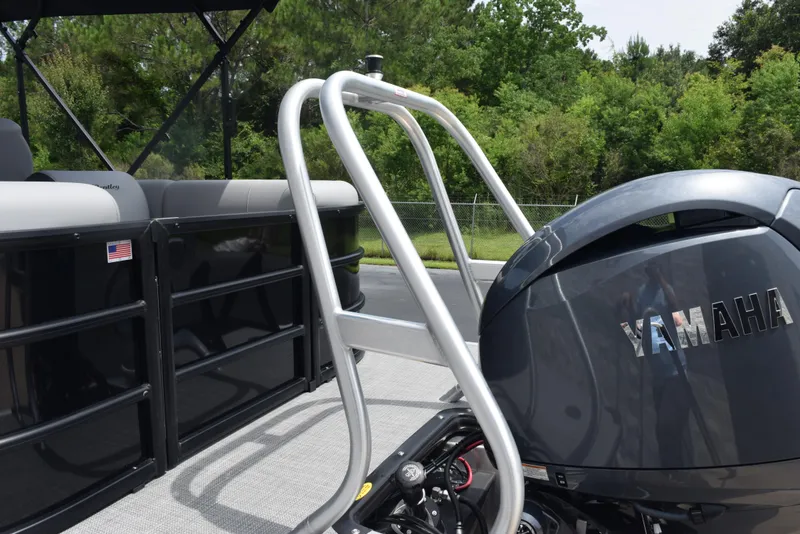 Slide: The Image of 2026 Bentley Pontoons Legacy 223 Navigator with Yamaha engine, docked outdoors. - 7