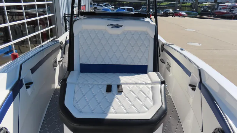 Slide: The Image of 2019 Sunsation 32 CCX boat interior with diamond-stitched seating and sleek design. - 10