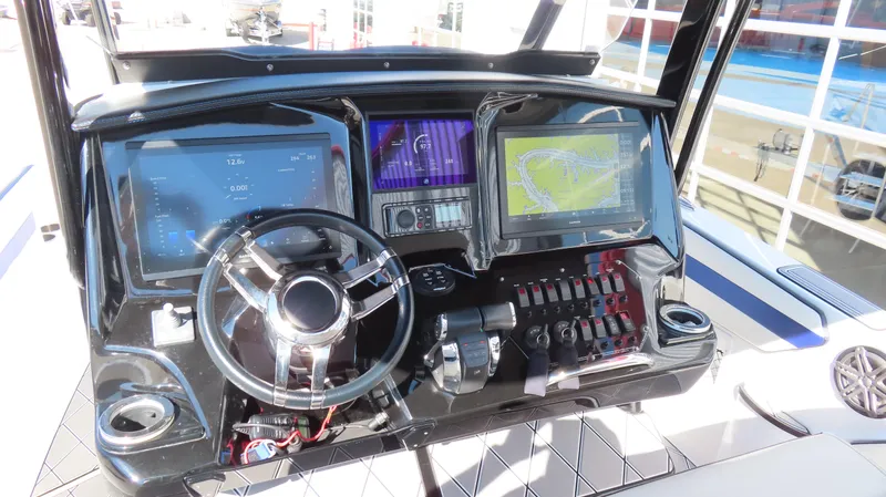 Slide: The Image of 2019 Sunsation 32 CCX dashboard with advanced navigation and control systems. - 11