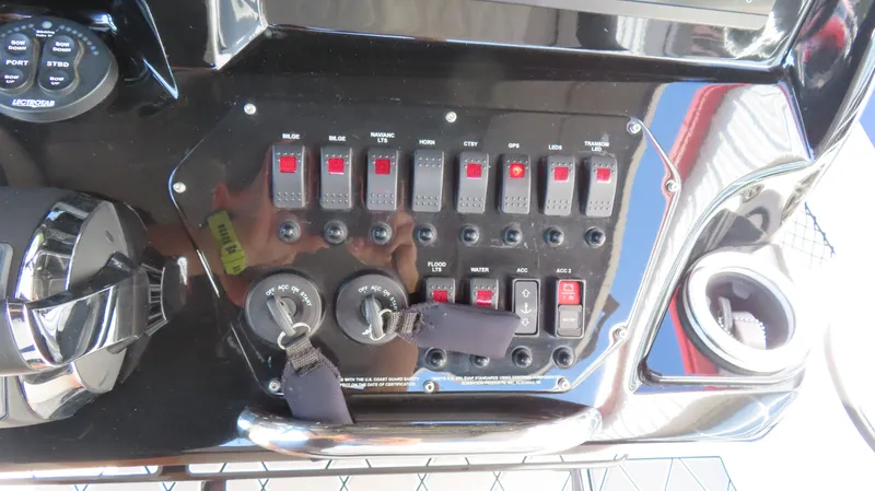 Slide: The Image of Control panel of 2019 Sunsation 32 CCX boat with switches and keys. - 13