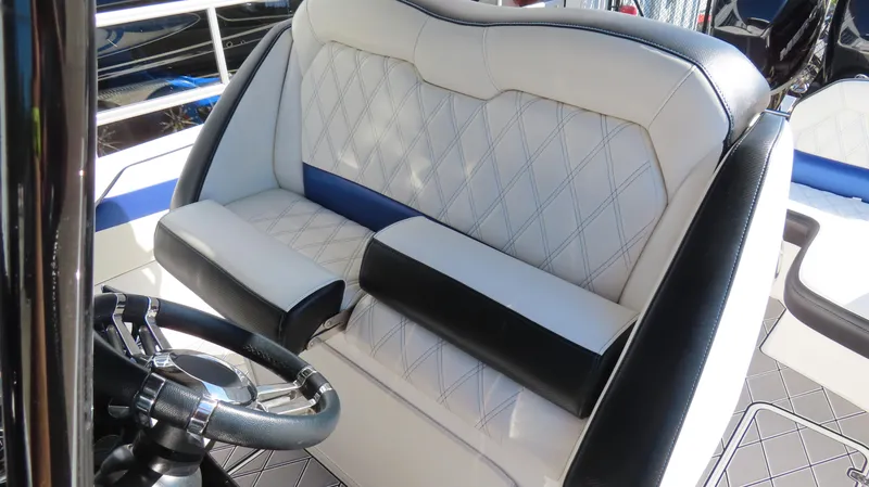 Slide: The Image of 2019 Sunsation 32 CCX boat interior with luxurious white and black seating. - 15