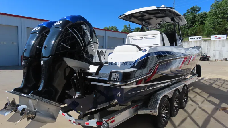 Slide: The Image of 2019 Sunsation 32 CCX boat with dual Mercury engines on a trailer. - 5