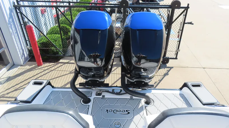 Slide: The Image of 2019 Sunsation 32 CCX boat with dual outboard engines, docked at marina. - 6