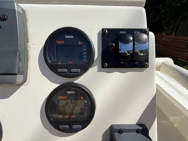 Slide: The Image of Dashboard of a 2015 Hewes Redfisher 18 boat with Yamaha gauges and controls. - 10
