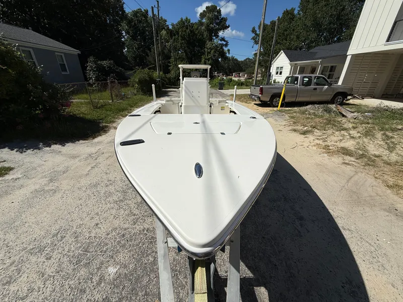 Slide: The Image of 2015 Hewes Redfisher 18 boat on trailer in residential area. - 4