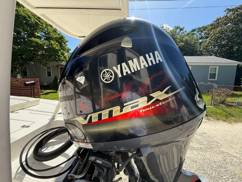 Slide: The Image of Yamaha VMAX outboard motor on 2015 Hewes Redfisher 18 boat, sunny day background. - 6