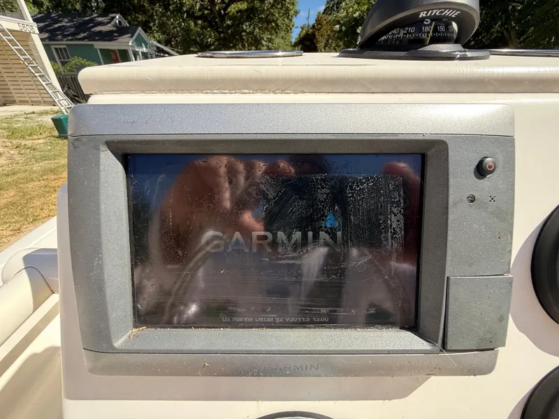 Slide: The Image of Garmin navigation system on 2015 Hewes Redfisher 18 boat dashboard. - 9