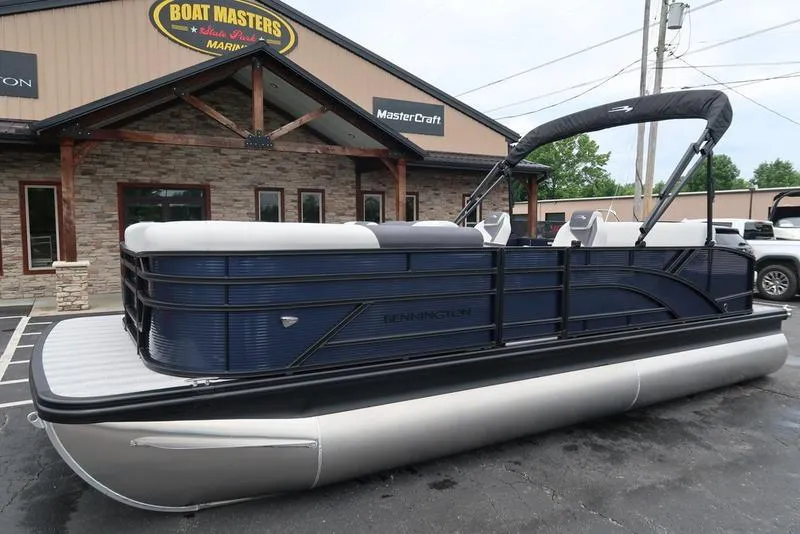 Slide: The Image of 2026 Bennington S Swingback 22 SSB pontoon boat at dealership. - 1