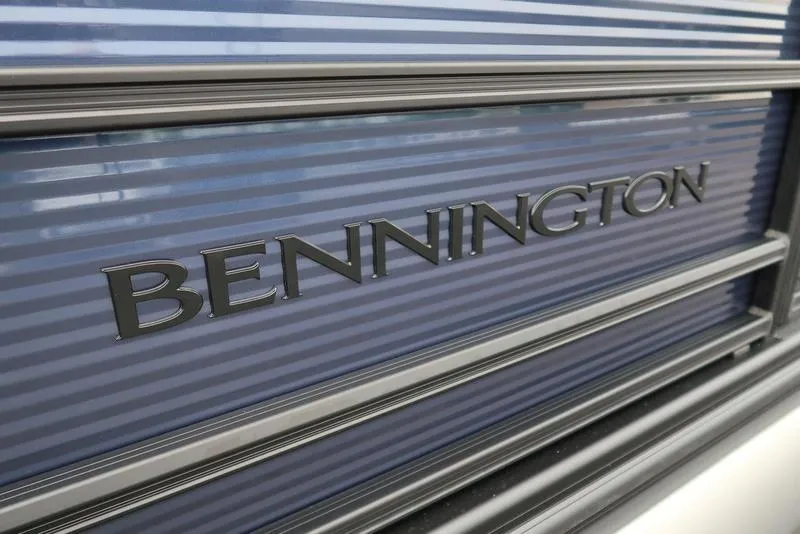Slide: The Image of 2026 Bennington S Swingback 22 SSB logo on sleek blue panel. - 11
