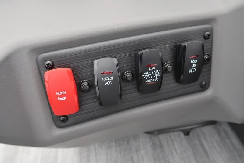 Slide: The Image of Control panel of 2026 Bennington S Swingback 22 SSB with horn, radio, navigation, and dock lights switches. - 20