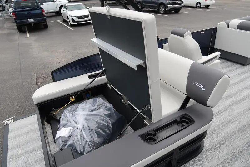 Slide: The Image of 2026 Bennington S Swingback 22 SSB boat interior with storage compartment open. - 25