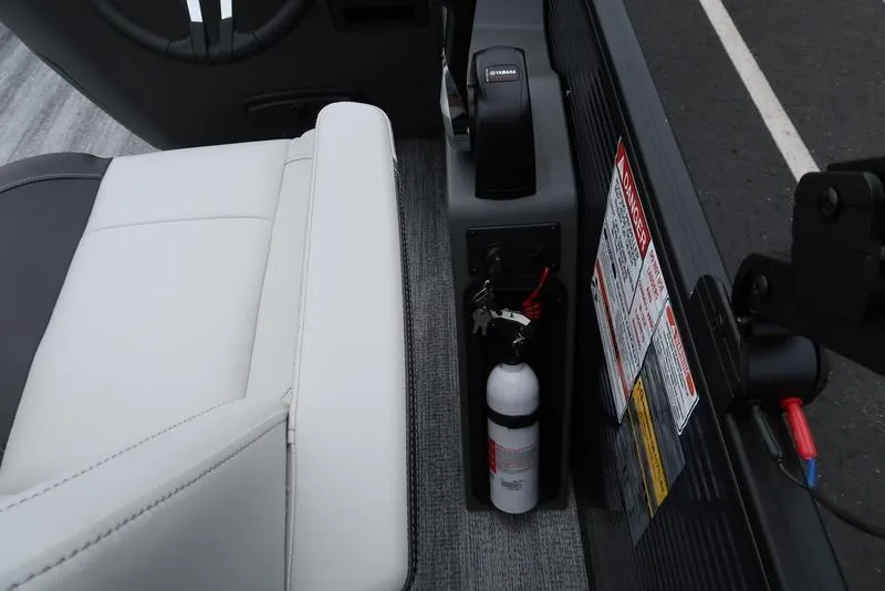 Slide: The Image of Interior of 2026 Bennington S Swingback 22 SSB with white seating and safety equipment. - 26