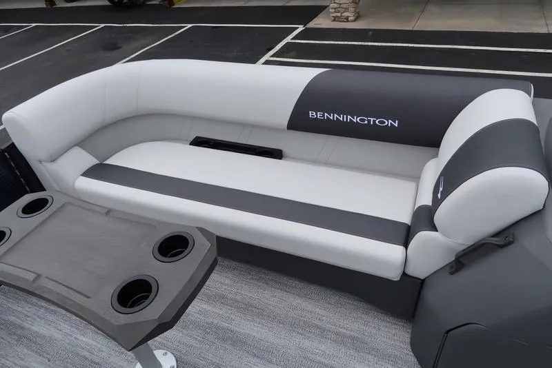 Slide: The Image of 2026 Bennington S Swingback 22 SSB boat interior with sleek seating and cup holders. - 28