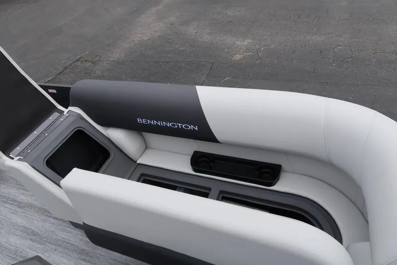 Slide: The Image of 2026 Bennington S Swingback 22 SSB boat interior with sleek seating and storage compartments. - 29