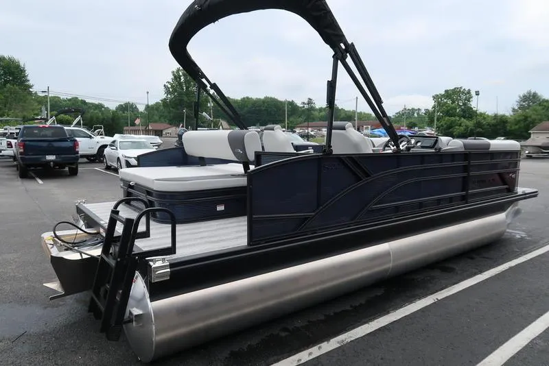Slide: The Image of 2026 Bennington S Swingback 22 SSB pontoon boat in parking lot. - 3