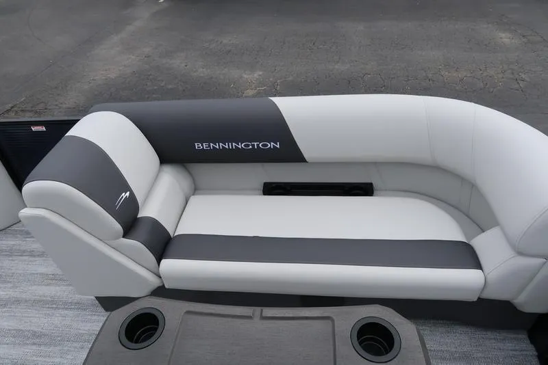 Slide: The Image of 2026 Bennington S Swingback 22 SSB boat seating with cup holders, featuring sleek gray and white design. - 30