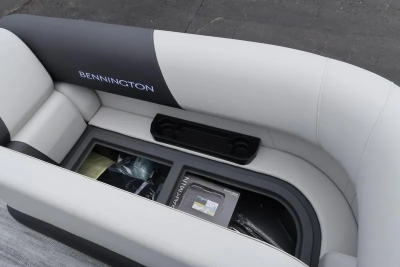 Slide: The Image of 2026 Bennington S Swingback 22 SSB boat interior with storage compartment and accessories. - 34