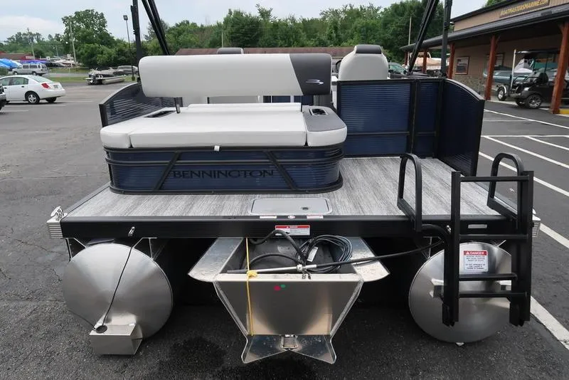 Slide: The Image of 2026 Bennington S Swingback 22 SSB pontoon boat, rear view in parking lot. - 36