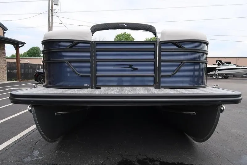 Slide: The Image of 2026 Bennington S Swingback 22 SSB pontoon boat, blue exterior, parked in a lot. - 37