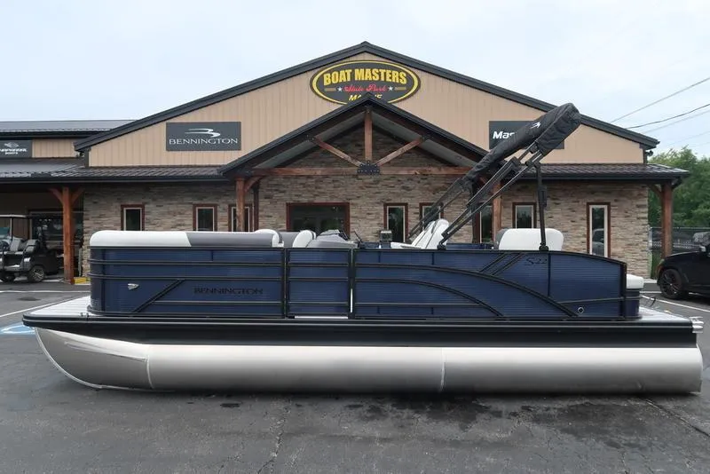 Slide: The Image of 2026 Bennington S Swingback 22 SSB pontoon boat displayed at dealership. - 4